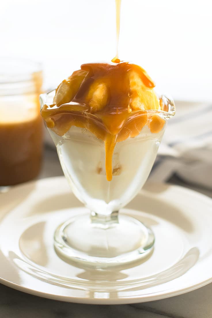 Shortcut caramel sauce being poured over ice cream.