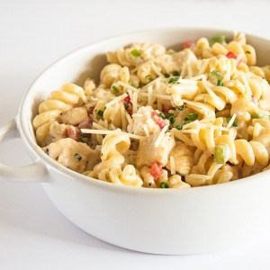 A rich and creamy pasta loaded with Parmesan cheese, chicken, and bell peppers, as easy as it is delicious. You don't want to miss this one! Recipe includes nutritional information, small-yield, make-ahead, and freezer instructions. From BakingMischief.com