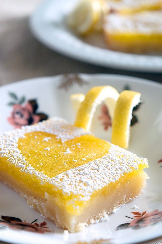 The EASIEST, best tasting lemon bars you've ever tried. Tart, sweet, and oh so pretty! Recipe includes nutritional information and freezing instructions.