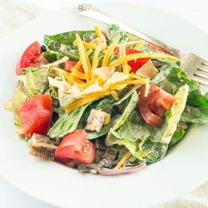 A slightly spicy chicken salad packed with black beans, corn, red onions, and cheese and topped with a chipotle cilantro sour cream dressing. This salad can easily be made burn-your-taste-buds-off-spicy if you are one of those... Recipe includes nutritional information, small-yield, make-ahead, and freezer instructions.