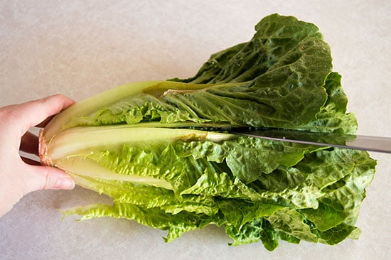 How to cut romaine lettuce for salads the fastest and easiest way possible. From BakingMischief.com