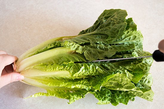 How to cut romaine lettuce for salads the fastest and easiest way possible. From BakingMischief.com