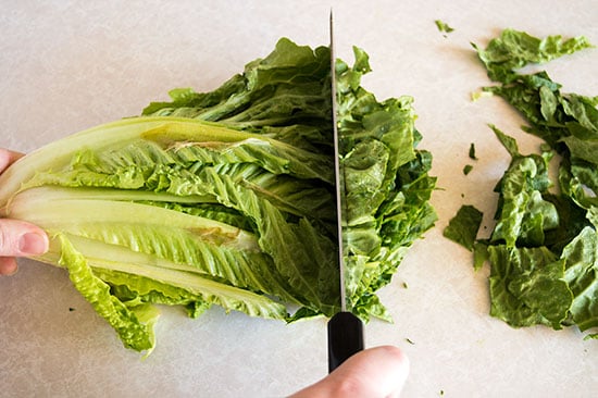 How to cut romaine lettuce for salads the fastest and easiest way possible. From BakingMischief.com