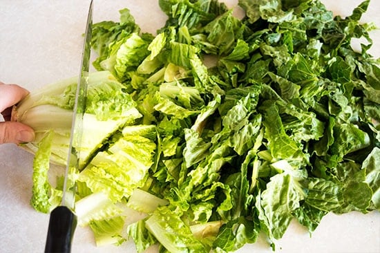 How to cut romaine lettuce for salads the fastest and easiest way possible. From BakingMischief.com