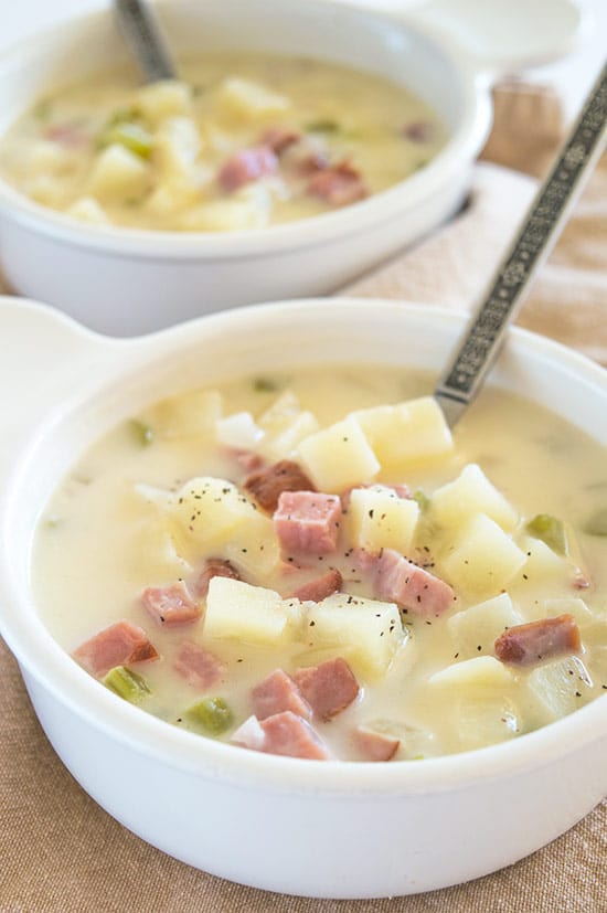 Easy and Comforting Ham and Potato Soup - Pure comfort food in a bowl. Easy, fast, and low-calorie, this is one of my favorite busy weeknight meals. Recipe includes nutritional information and make-ahead instructions. From BakingMischief.com