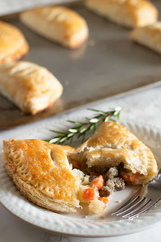 Image of beef pasties made with leftover buttermilk on a white plate.