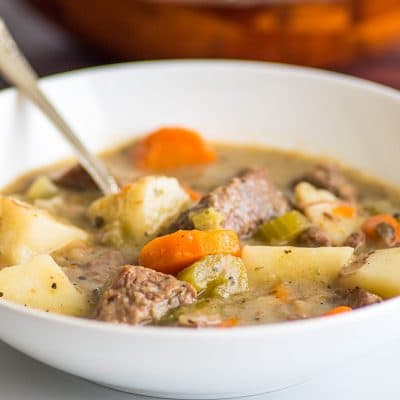 Simple beef stew in a white bowl.