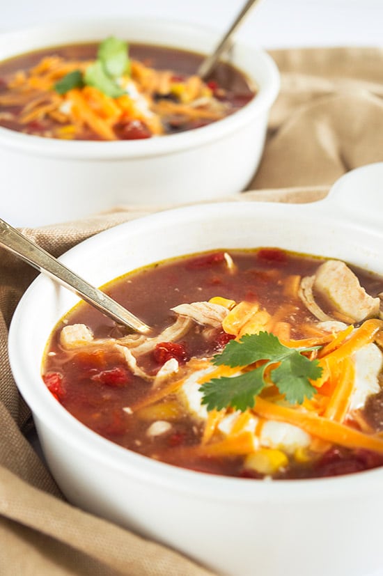 World's Easiest Chicken Taco Soup - A healthy and delicious chicken soup for quick weeknight dinners. So good, you'd never guess it takes fewer than 10 minutes to make. From BakingMischief.com