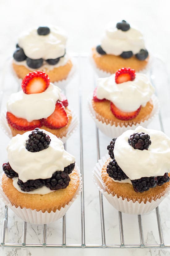 Pound Cake Cupcakes are a perfect excuse to eat cupcakes for breakfast. Light, buttery pound cake topped with the berries of your choice and smothered in a lot more than a dollop of homemade whipped cream.