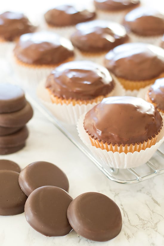 Tagalong Cupcakes are pound cake covered in peanut butter buttercream and dipped in chocolate. A perfect cupcake version of the Girl Scouts' best cookie. From BakingMischief.com