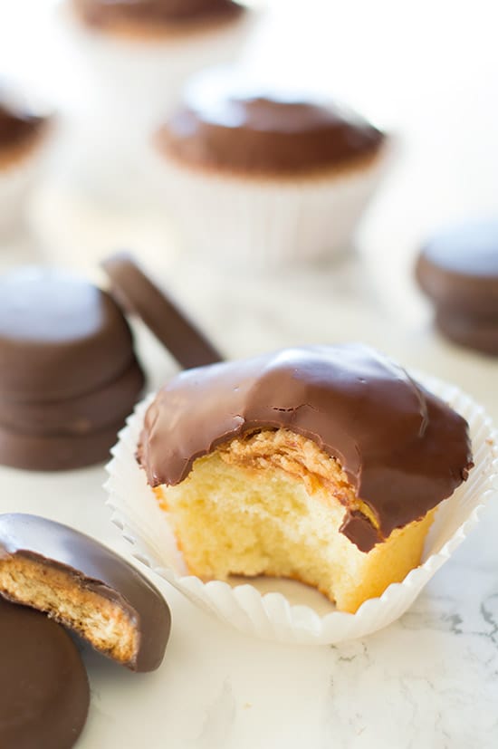 Tagalong Cupcakes are pound cake covered in peanut butter buttercream and dipped in chocolate. A perfect cupcake version of the Girl Scouts' best cookie. From BakingMischief.com