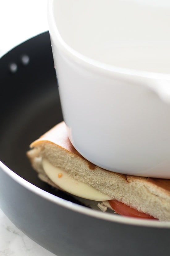 Perfectly cooked panini, crunchy and toasted on the outside, warm, gooey, and cheesy on the inside, all without using a panini press! Recipe includes nutritional information. From BakingMischief.com