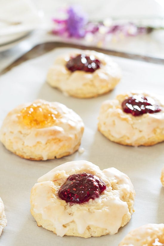 Adorable buttermilk jam scones baked with your favorite jam inside and brushed with a buttery vanilla glaze.