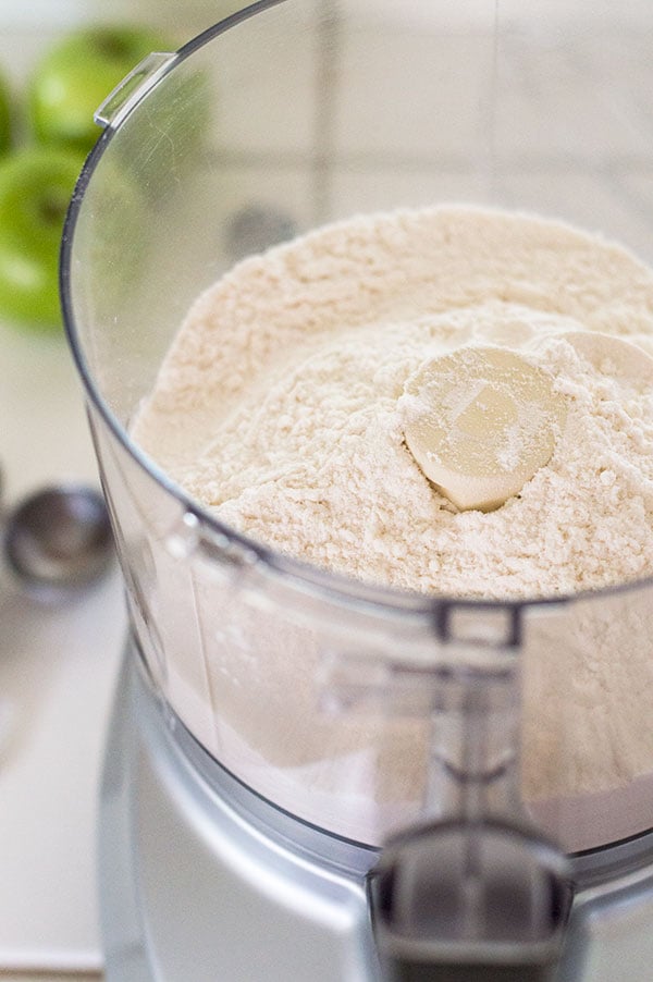 Flour in a food processor to make buttermilk pie crust.
