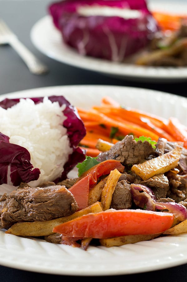 Lomo Saltado on a white plate.