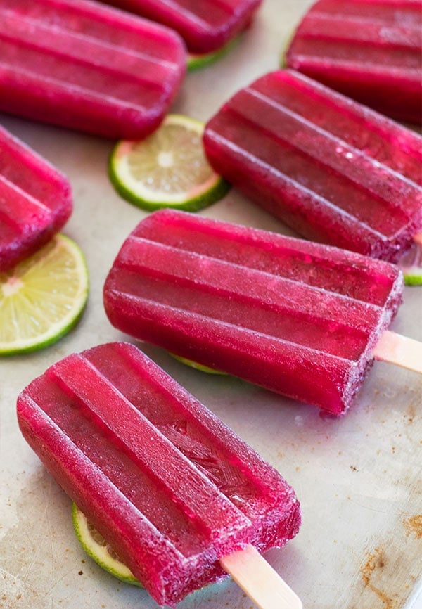Super easy Tinto De Verano red wine popsicles made with your favorite red wine, lemon lime soda, and a homemade lime simple syrup. Delicious, boozy treats perfect for a grown-up summer. Recipe includes nutritional information. From BakingMischief.com