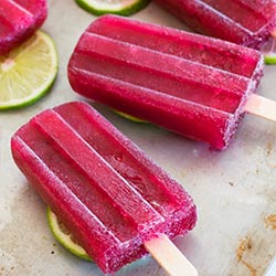 Super easy Tinto De Verano red wine popsicles made with your favorite red wine, lemon lime soda, and a homemade lime simple syrup. Delicious, boozy treats perfect for a grown-up summer. Recipe includes nutritional information. From BakingMischief.com