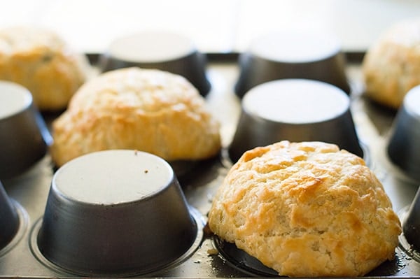 Apple pie in sundae form! Tart Granny Smith apples cooked with brown sugar and cinnamon and dowsed in caramel sauce. Served over vanilla ice cream in a flaky homemade (easy!) buttermilk pie crust shell. Recipe includes nutritional information. From BakingMischief.com