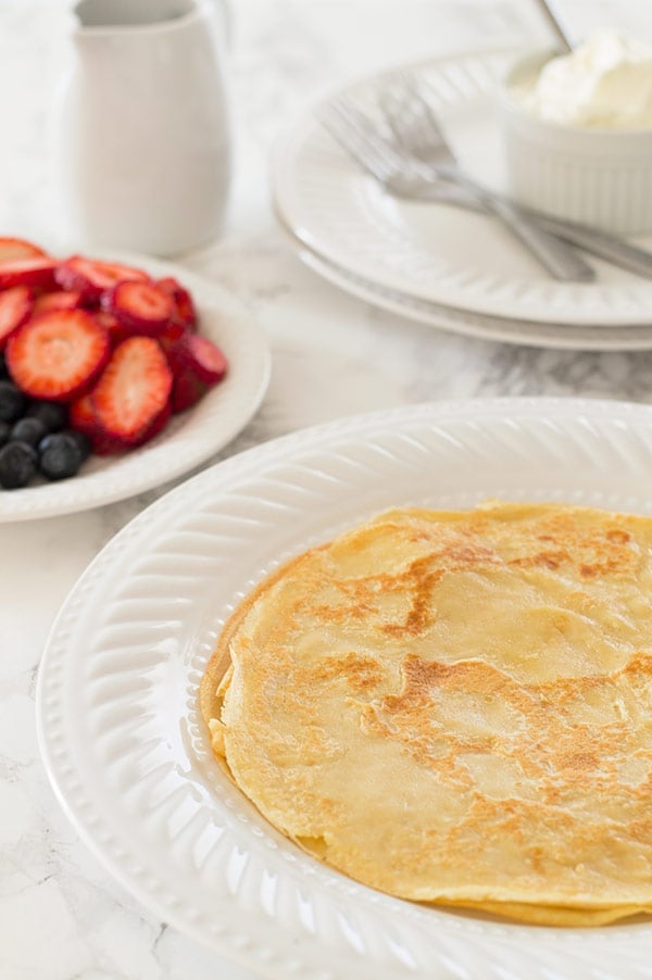 Crepes on a white plate.