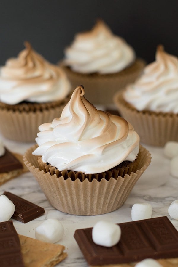 S'mores cupcakes on a marble counter.
