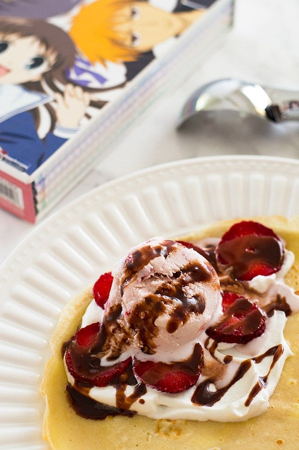 Strawberry and Nutella Crepe Cone on a plate before being rolled.