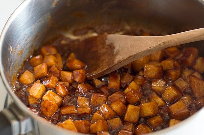 Caramelized cinnamon apples being cooked for apple muffins.