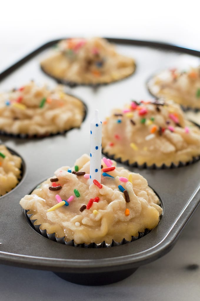 Cupcake dog popsicles in a baking tray.