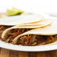 Easy slow cooker beef fajitas are a fantastic, cheap, and simple dinner for busy weeknights!