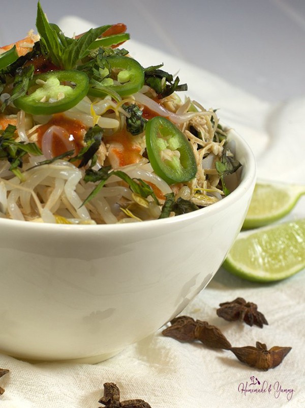 Pho in a white bowl.