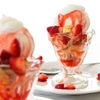 Strawberry shortcake sundaes for two, crumbly buttermilk shortcake with vanilla ice cream and an easy and delicious homemade strawberry ice cream topping. This is my very favorite ice cream sundae! Recipe includes nutritional information. From BakingMischief.com