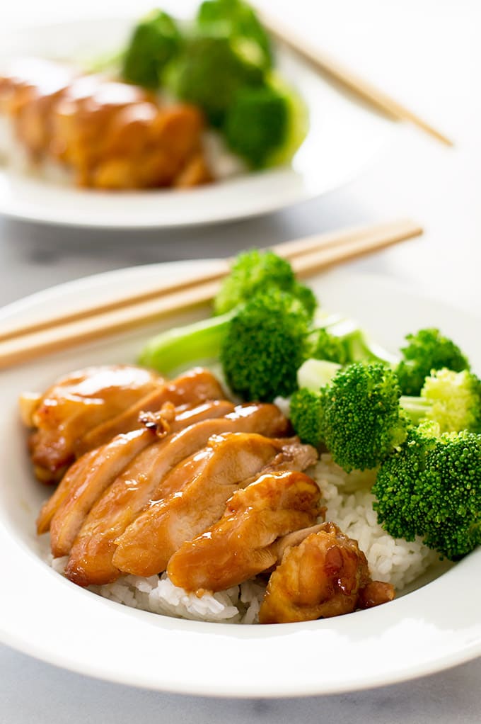 Bowls of Teriyaki chicken with rice and broccoli.