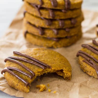 Pumpkin shortbread cookies on parchment paper.