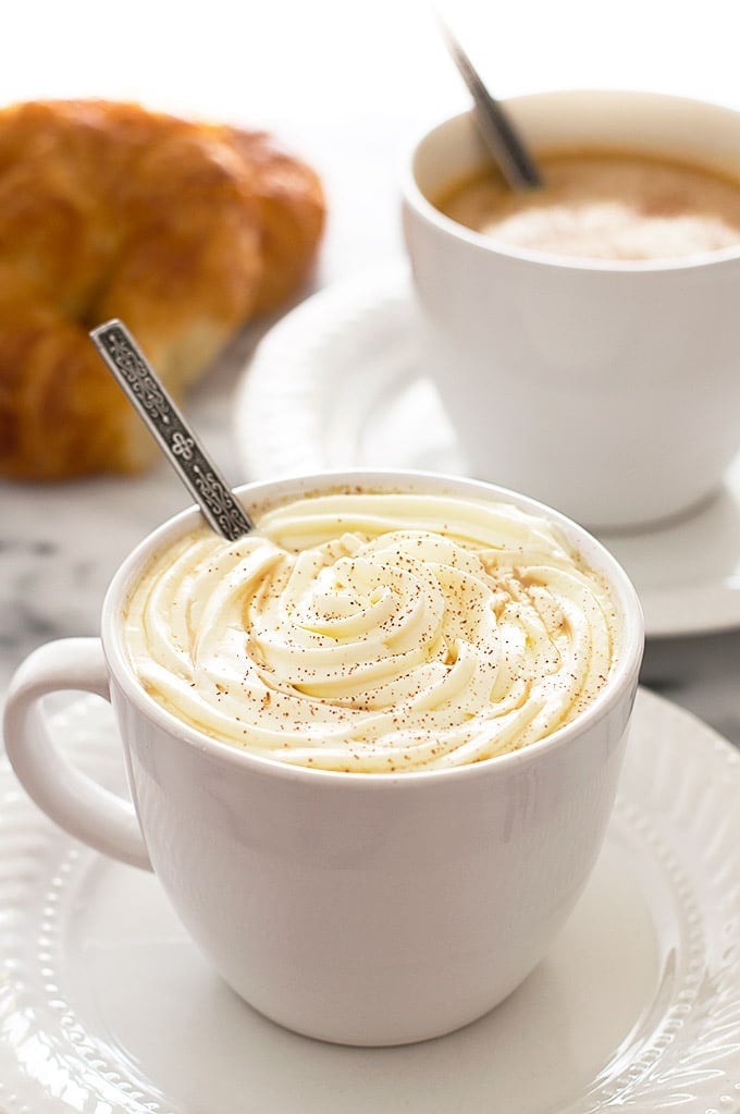 Pumpkin spice lattes on a table.