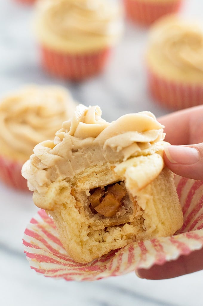 Apple pie cupcake with a bite out of it.