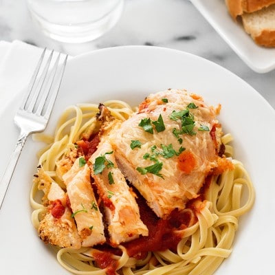 Quick and easy baked Chicken Parmesan for Two can be on your table in under half an hour and is a fantastic, filling weeknight meal when you have a craving for pasta. Recipe includes nutritional information. From BakingMischief.com