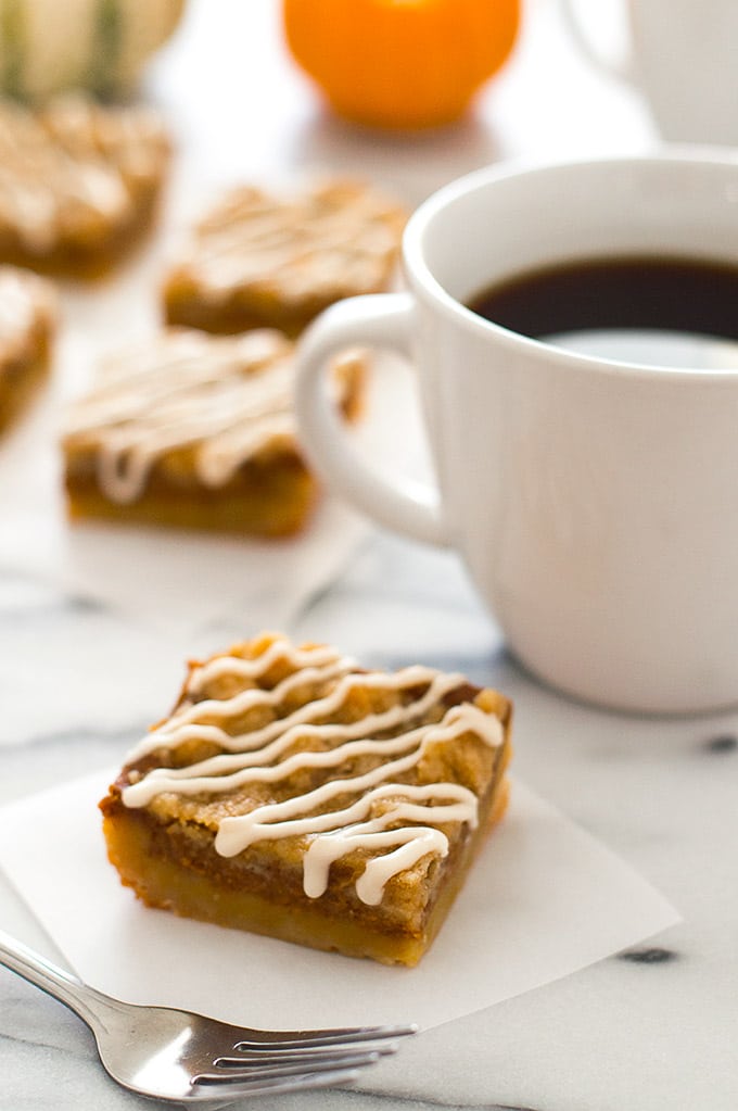 Pumpkin pie bar with a cup of coffee.