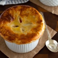 These Individual Chicken Pot Pies are easy to make, stuffed with chicken, carrots, and celery, and topped with a delicious flaky buttermilk crust.