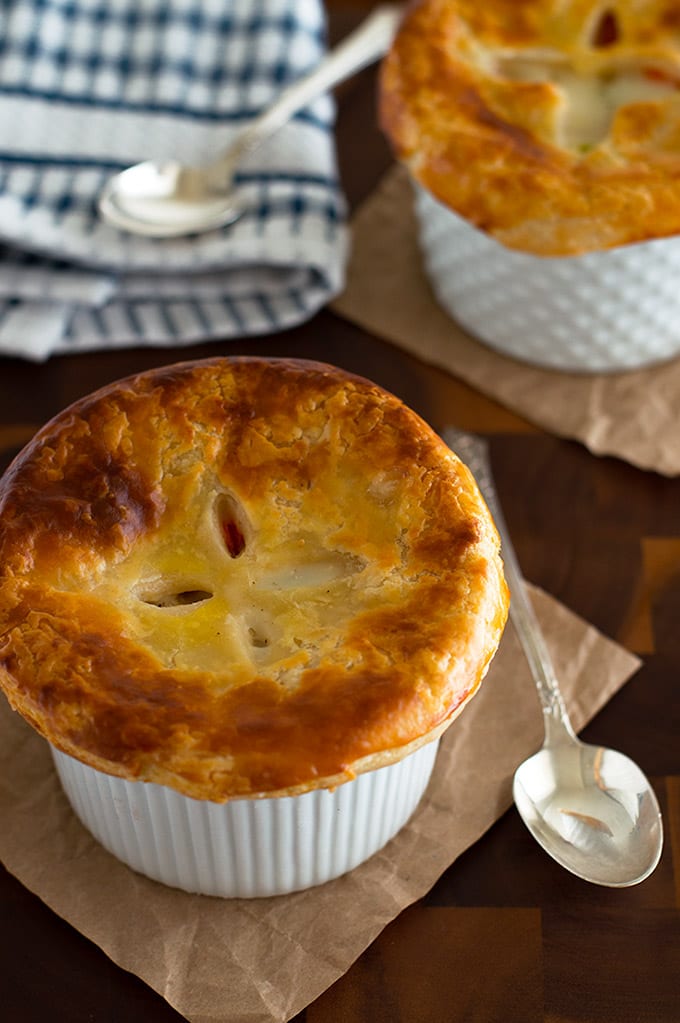 Individual Chicken Pot Pies in white ramekins.