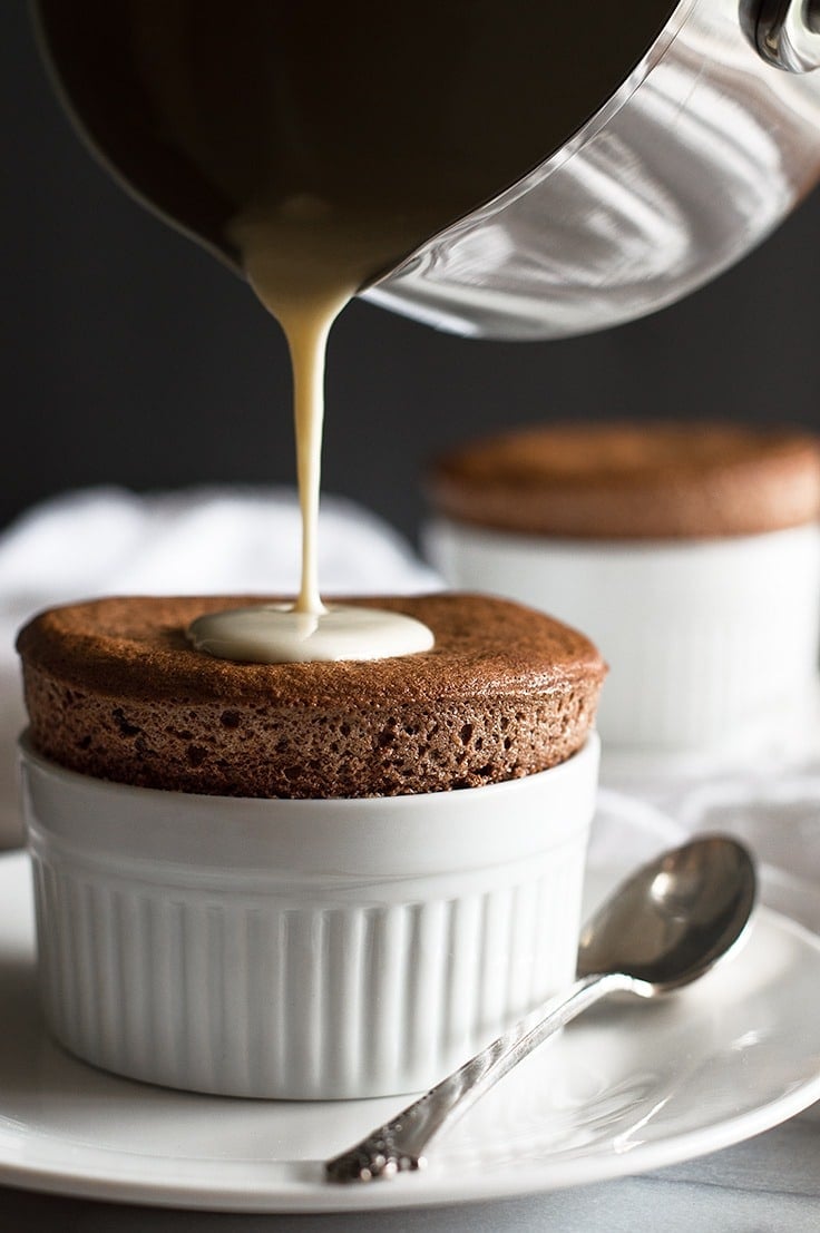 Chocolate Souffles for Two with Creme Anglaise are a perfect make ahead date night dessert. From BakingMischief.com