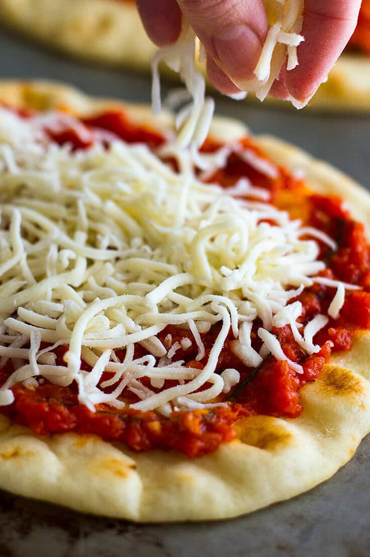 Hawaiian Naan pizza being made.