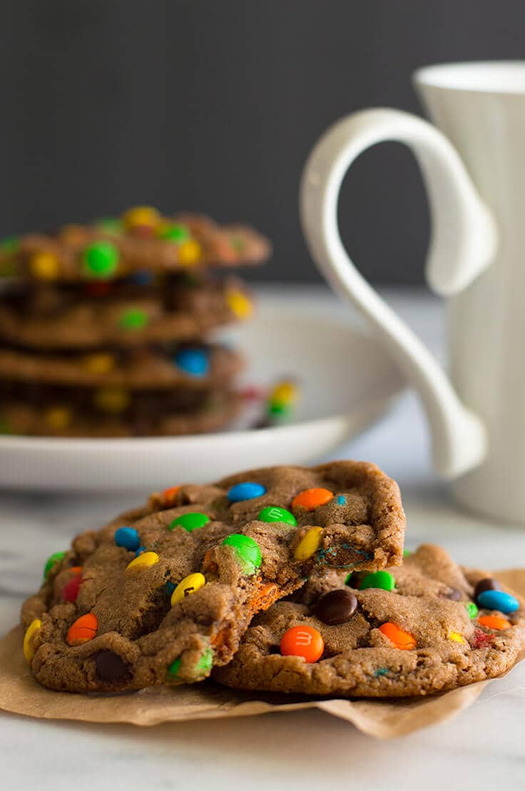 Mini M&M Cookies on parchment paper.