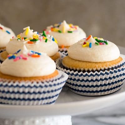 This Small-batch Vanilla Cupcakes recipe makes six fabulous moist vanilla cupcakes topped with a quick and easy American buttercream frosting.