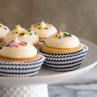 This Small-batch Vanilla Cupcakes recipe makes six fabulous moist vanilla cupcakes topped with a quick and easy American buttercream frosting.