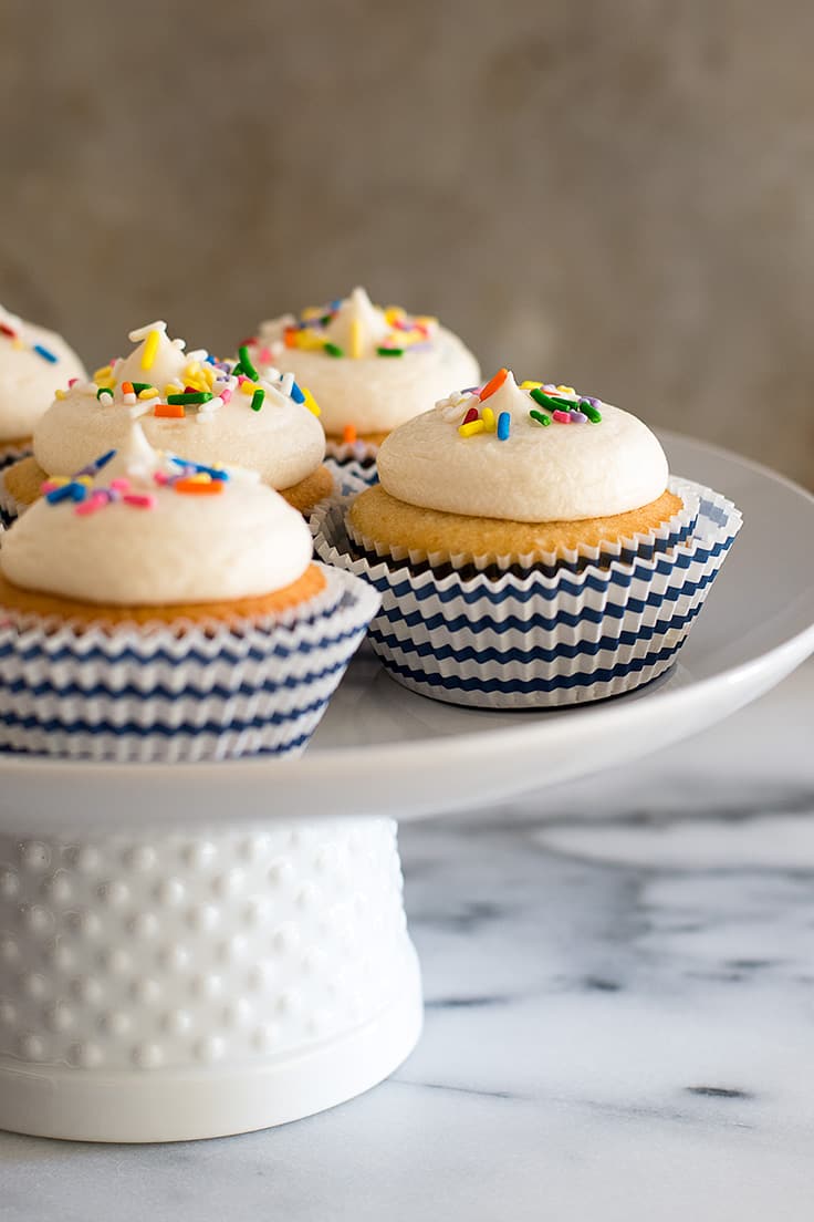 This Small-batch Vanilla Cupcakes recipe makes six fabulous moist vanilla cupcakes topped with a quick and easy American buttercream frosting.