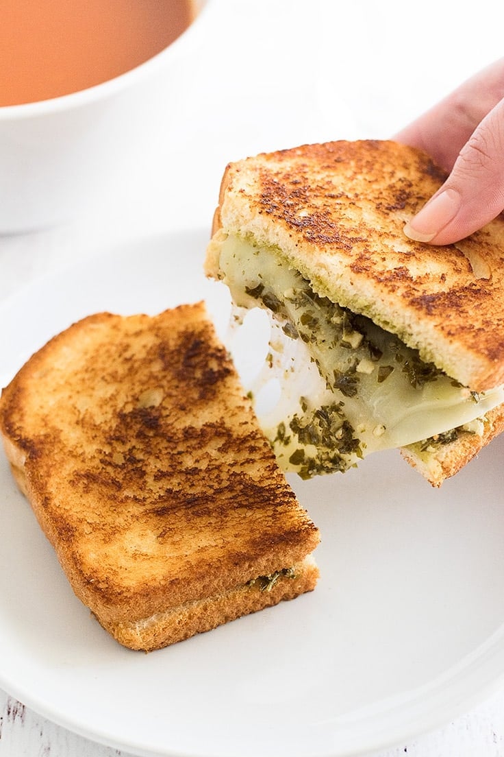 Need a lunch or dinner for one? Try this Pesto Grilled Cheese Sandwich paired with a bowl of tomato soup!