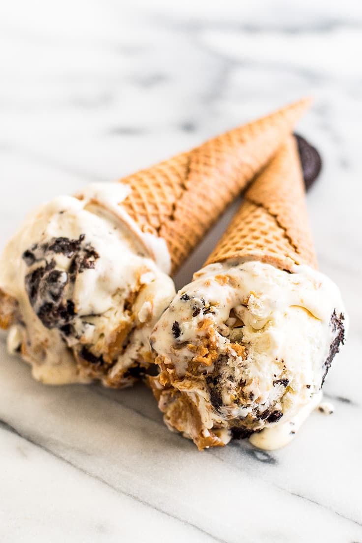 This No-churn Peanut Butter Oreo Ice Cream is creamy homemade vanilla ice cream with swirls of peanut butter, chunks of Oreos, and Reese's Peanut Butter Cups Minis throughout. What could be better?