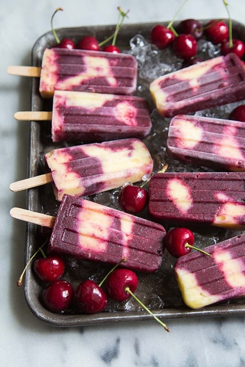 Swirled Cherry Pineapple Popsicles from The Little Epicurean - My favorite popsicle tips and tricks plus some of the best popsicle recipes on the internet!