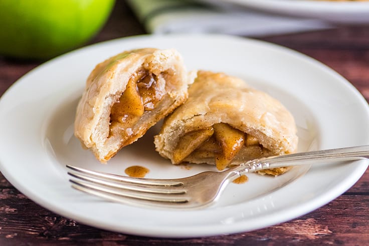 Apple hand pie split open on a plate.