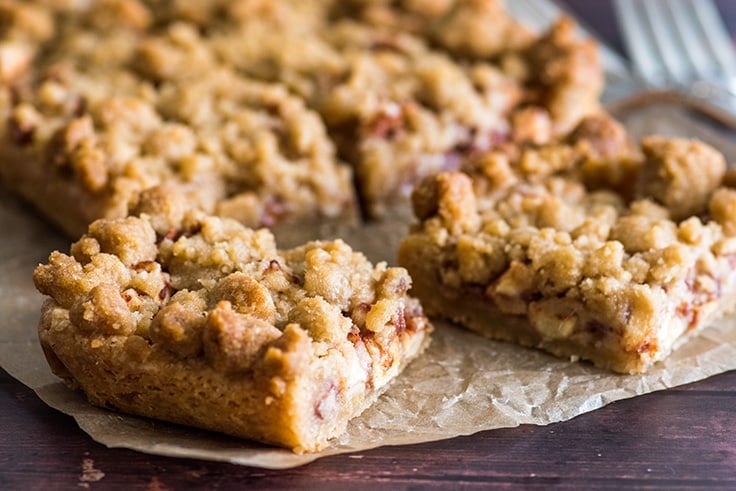Apple pie bars on parchment paper.