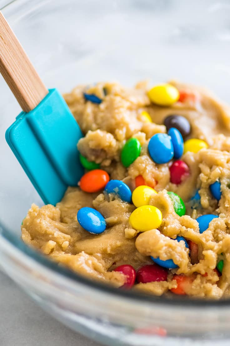 Small-batch M&M Cookie dough in a glass bowl.